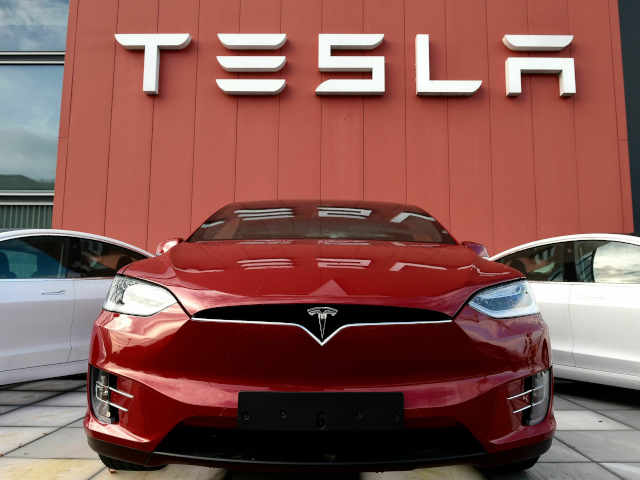 Tesla net income and earnings drop more than 20%